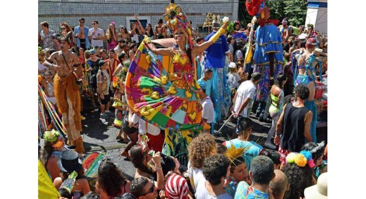 Brazil carnival artist rises above pandemic -- on stilts
