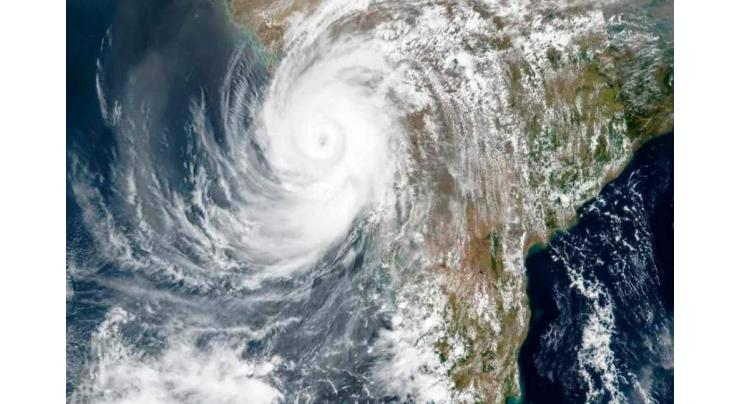 24 dead, dozens missing as cyclone batters Covid-stricken India
