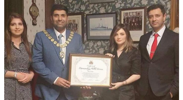 Armeena Khan receives certificate over public service in the UK