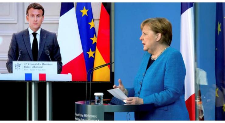 Macron, Merkel want explanations from US, Denmark over spying report
