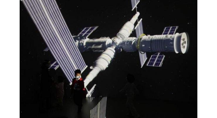 China's crewed spacecraft docks with space station module: officials
