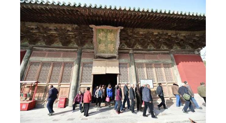China's largest Taoist temple launches mural restoration
