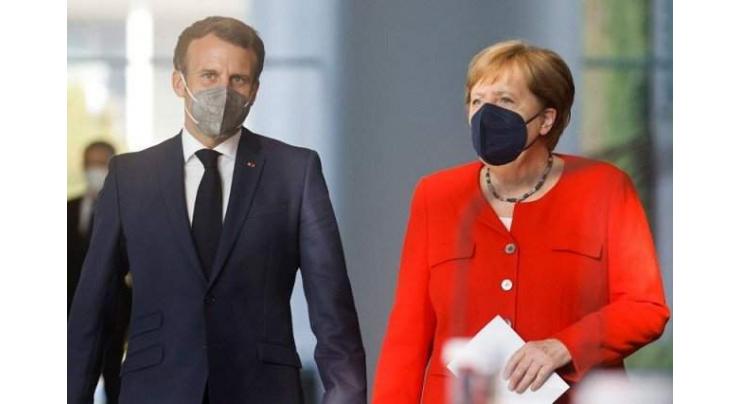 Merkel, Macron Want EU to Consider Inviting Putin to Summit - Reports