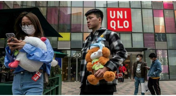 Uniqlo parent firm downgrades outlook despite earnings rebound
