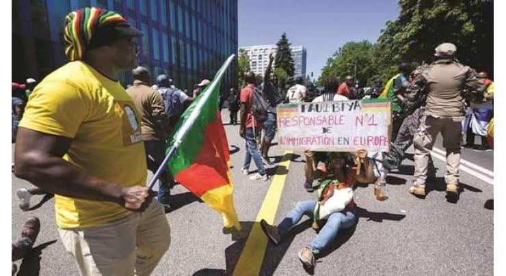 Protesters rally outside Cameroon president's Geneva hotel
