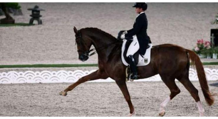 Werth makes Olympic history as Germans win team dressage
