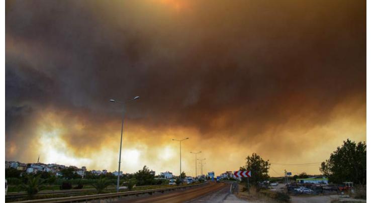 Forest fires rage near Turkish resorts, killing three
