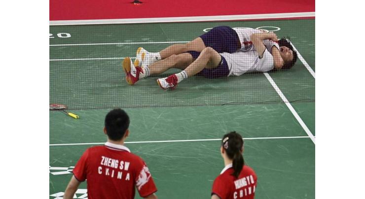 Chinese shuttlers march on at Tokyo Games

