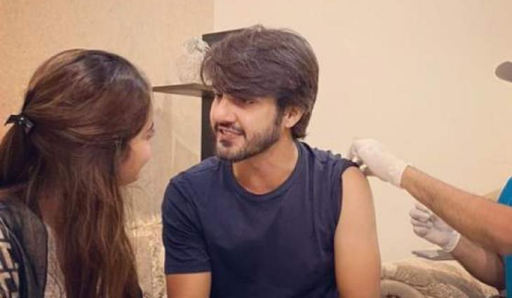 Ahsan Mohsin, supported by Minal Khan, gets COVID jab