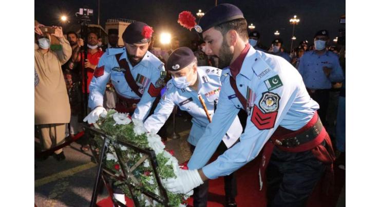 Islamabad policemen light-up candles to pay tribute to martyred colleagues