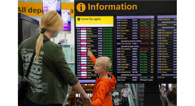 Speechless and sleepless: UK airport joy as families reunite
