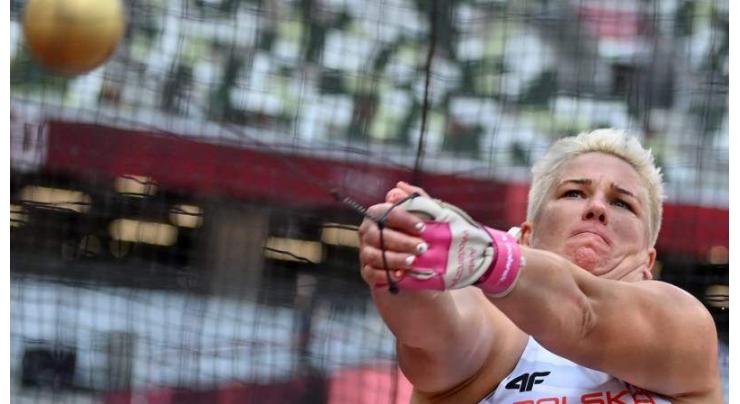 Poland's 'queen of the hammer' makes history with third Olympic gold
