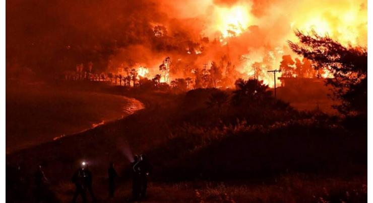 Fire surrounds Greek island monastery, 150 houses burnt

