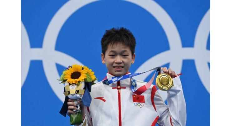 China's Quan, 14, wins Olympic gold with three perfect dives
