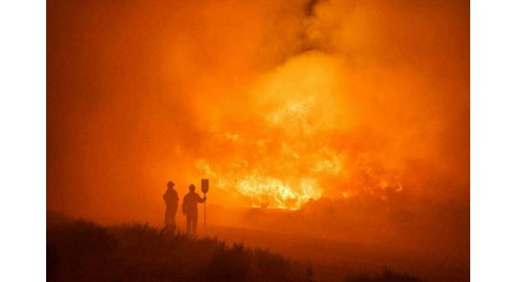 Firefighters gain on Spanish blaze as heatwave eases
