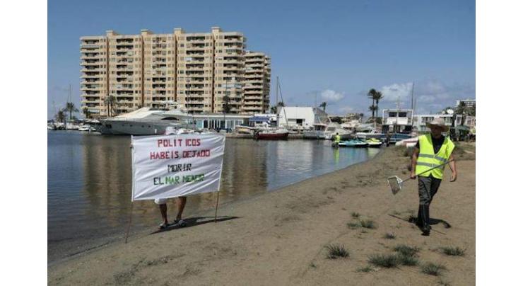 Thousands rally to 'hug' Spain's dying Mar Menor lagoon
