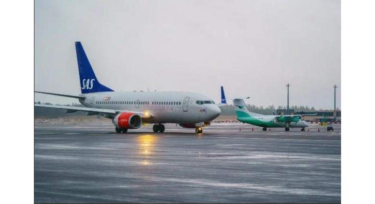 SAS narrows loss as air travel remains muted
