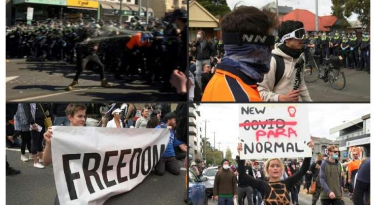 Police trampled, hundreds arrested in Melbourne anti-lockdown protest
