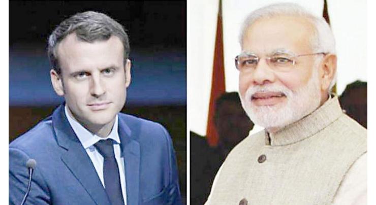 Macron and Modi vow to 'act jointly' after subs dispute
