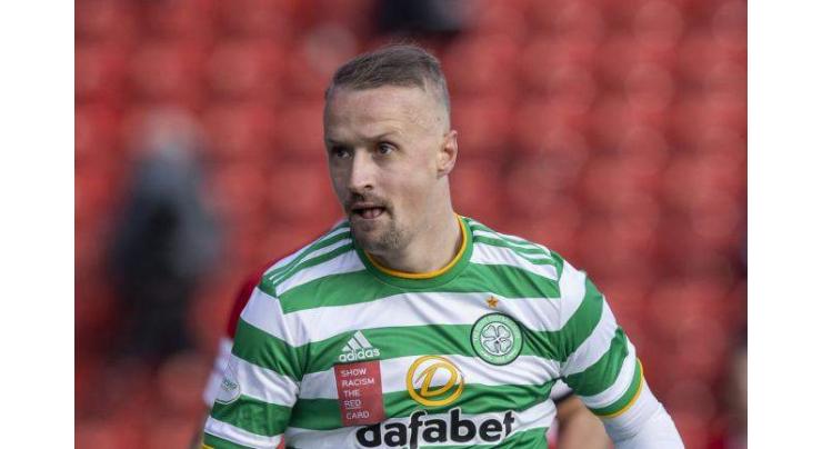 Scotland striker Griffiths charged for kicking smoke bomb at fans
