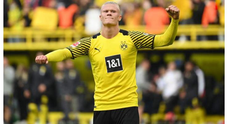 Haaland scores twice on comeback as Dortmund go top
