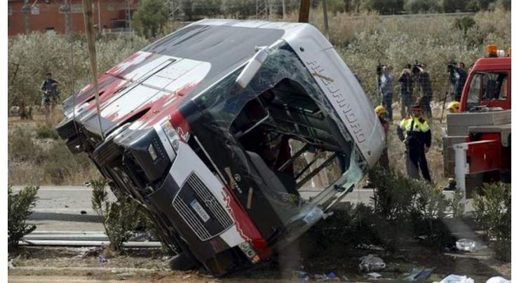 Ecuador bus crashes into ravine, 11 dead
