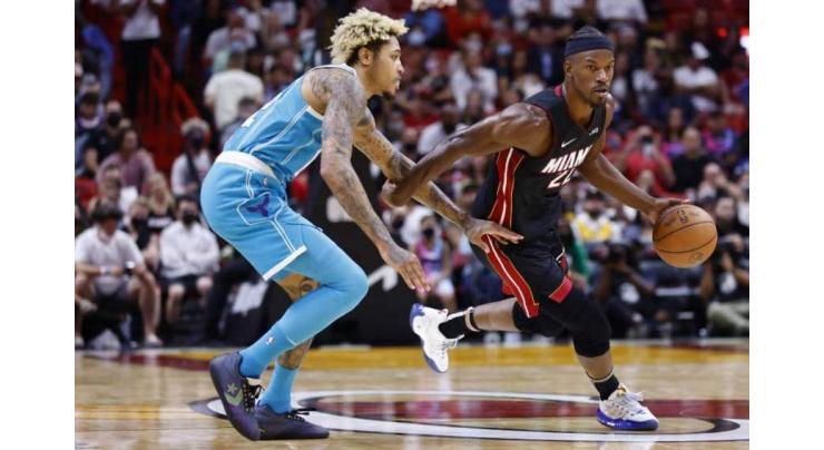 Butler gets hot as Heat roll over Hornets, James powers Lakers
