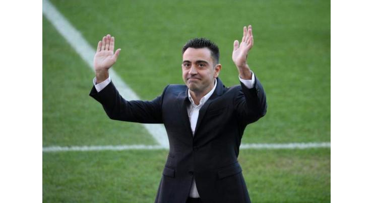 Xavi unveiled as Barcelona coach to fans at Camp Nou
