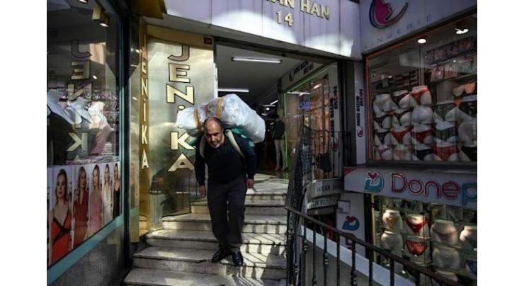 Porters carry Istanbul's trade traditions on their backs
