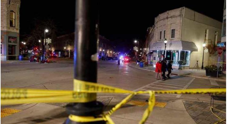 Vehicle strikes Christmas parade in US, killing five and wounding 40

