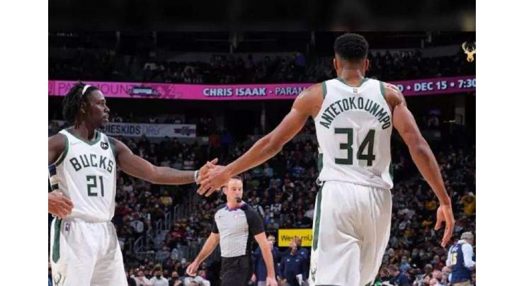 Bucks roll over short-handed Nuggets, Suns win 15th straight
