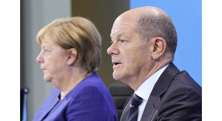 Germany's Merkel, Scholz Announce New Curbs for Unvaccinated, Back Mandatory Shots