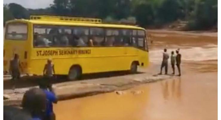More than 20 drown as bus swept into flooded river in Kenya
