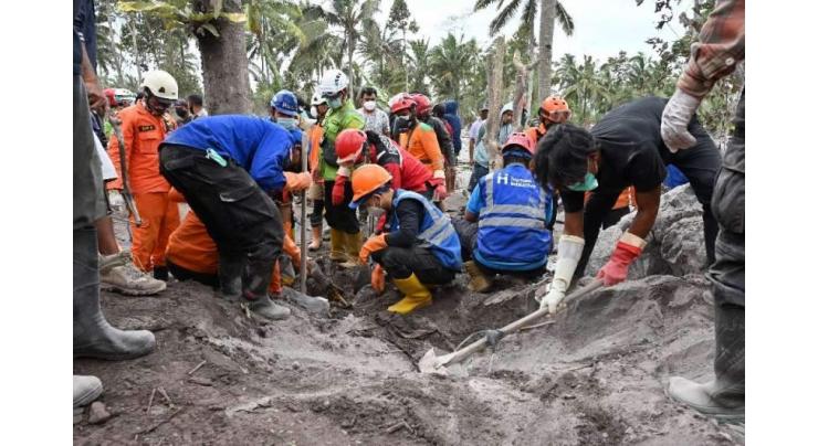 Indonesia volcano erupts again, hampering rescue operations
