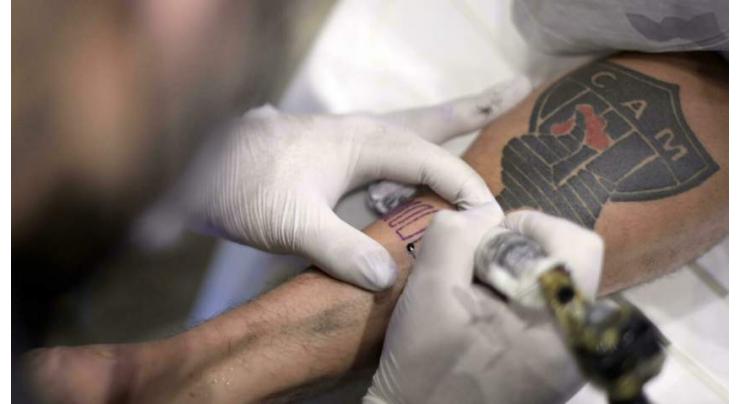 Brazil football club gives fans free tattoos
