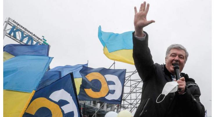 Facing arrest, ex-leader returns to 'defend Ukraine' from Russia
