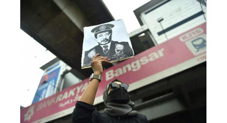 Malaysian protesters demand resignation of anti-graft chief
