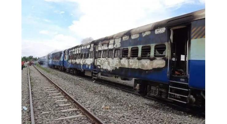 Mobs burn Indian train carriages in rail jobs protest
