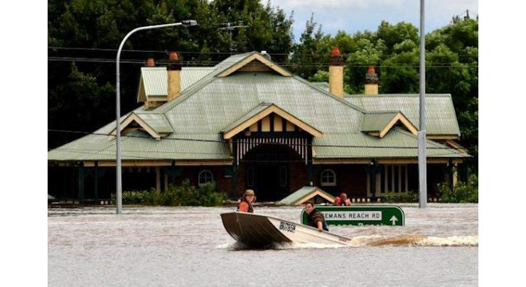 Protesters rally as Australian PM tours flood disaster
