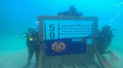 عناصر نسائية من غواصات شرطة أبوظبي تشاركن بزراعة الشعب المرجانية في الفجيرة