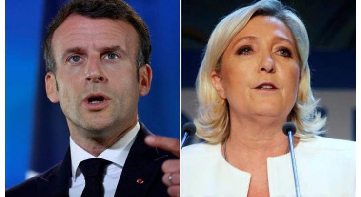 Macron clashes with Le Pen over Islamic headscarf ban

