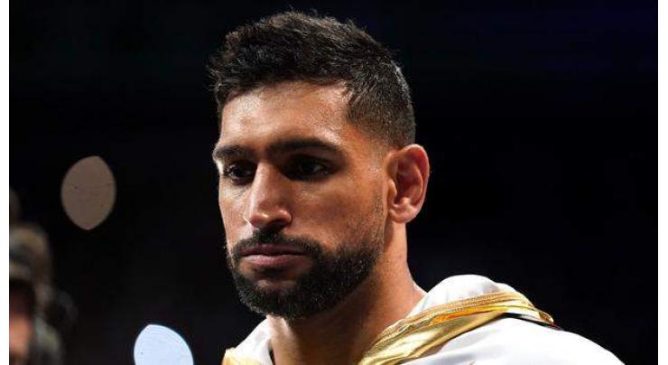 Amir Khan announces retirement from pro boxing
