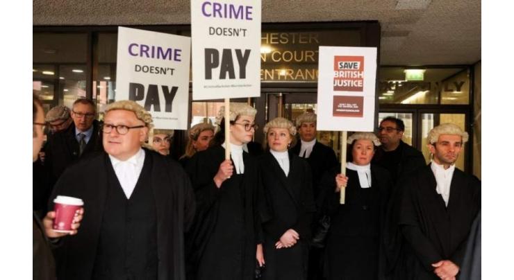 Criminal lawyers in England and Wales stage pay strike
