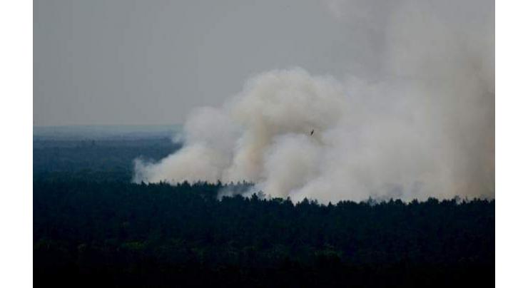 Explosions, 'unprecedented' fire hit Berlin forest
