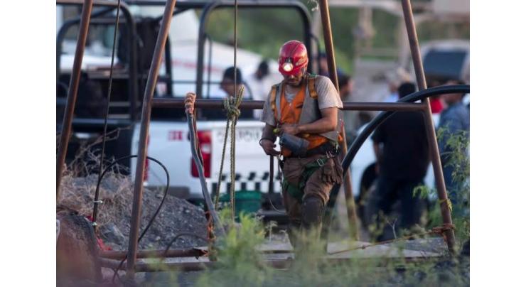 Mexico says rescuers close to entering mine where workers trapped
