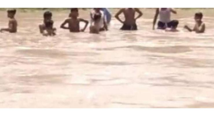 Children bathing in flood waters irks commissioner
