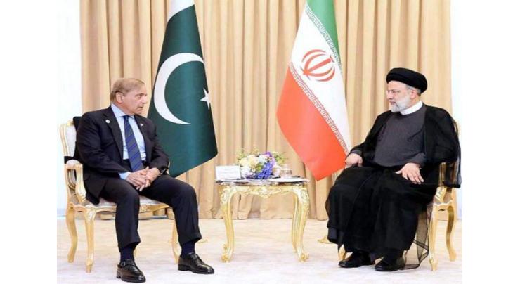 PM meets Iranian president, underscores commitment to enhance bilateral relations

