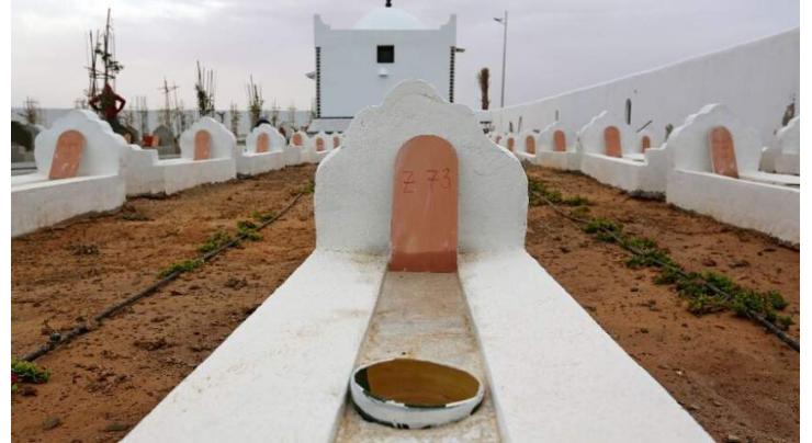 Parents of missing Tunisians dig up migrant graves: witnesses
