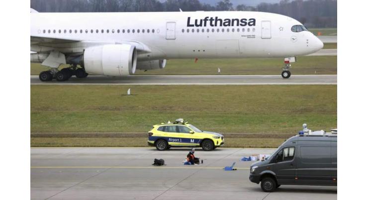 Climate activists storm runways at two German airports
