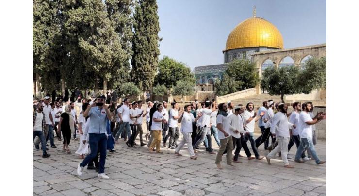 Jewish settlers wave Israeli flag at Al-Aqsa Mosque complex in East Jerusalem
